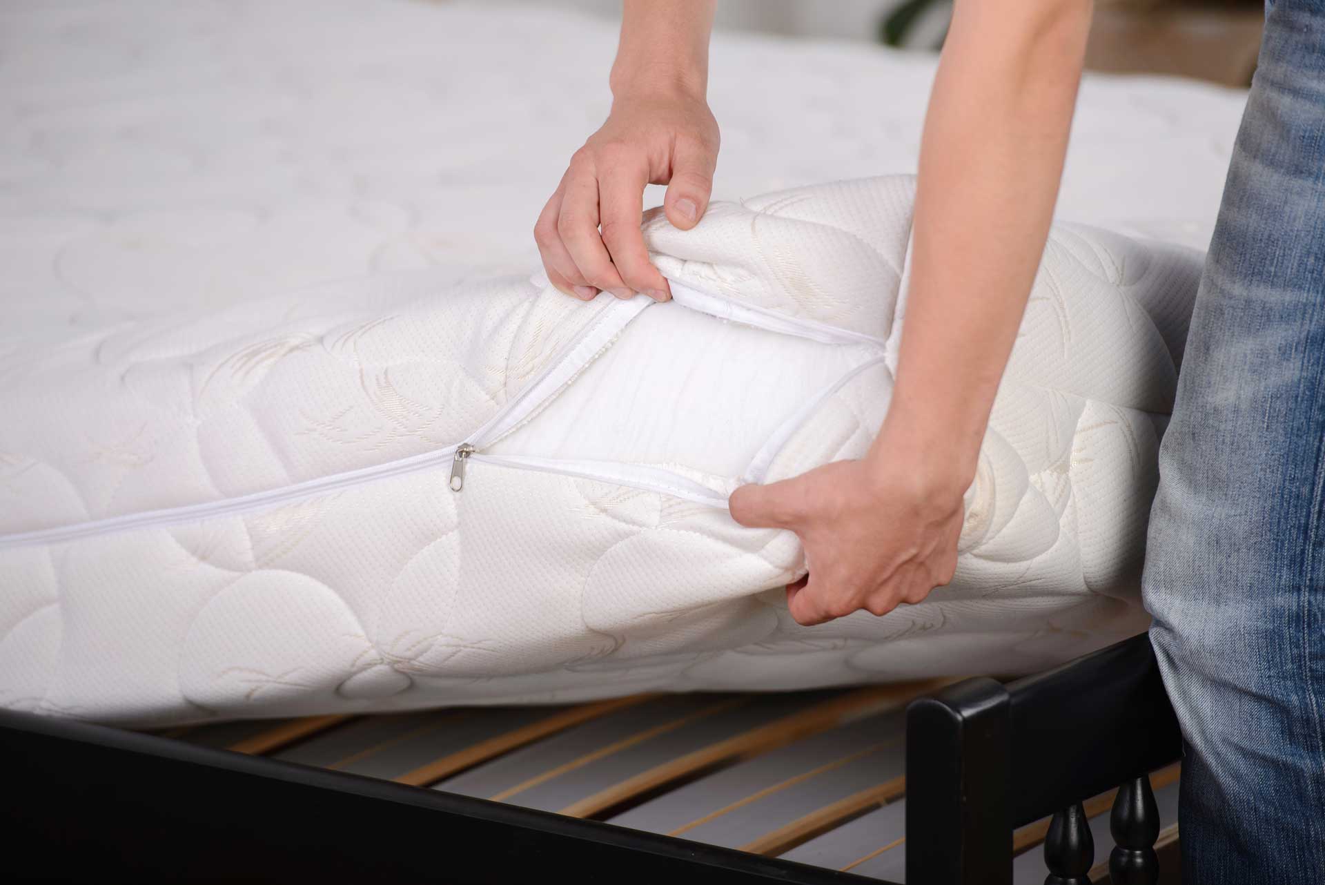 man-holding-demonstrations-quality-mattress-bedroom